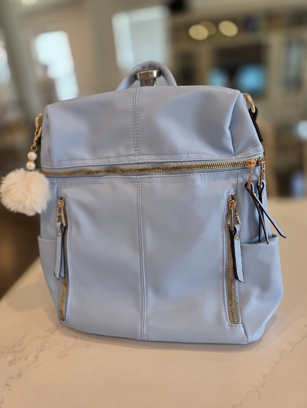 Light Blue Leather Like Women's Backpack Purse with Gold Hardware.